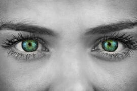 Black and white photo of woman with green eyes