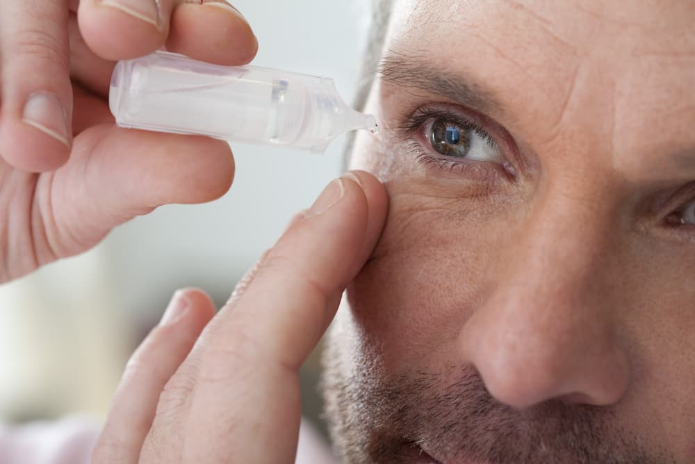 Man Using Eyedrops