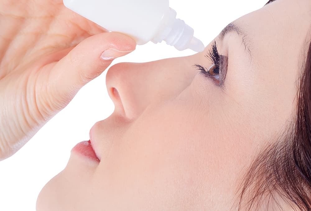 Woman Using Eye Drops