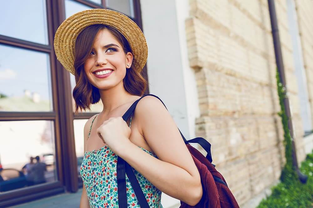 Young Woman In Straw Hat