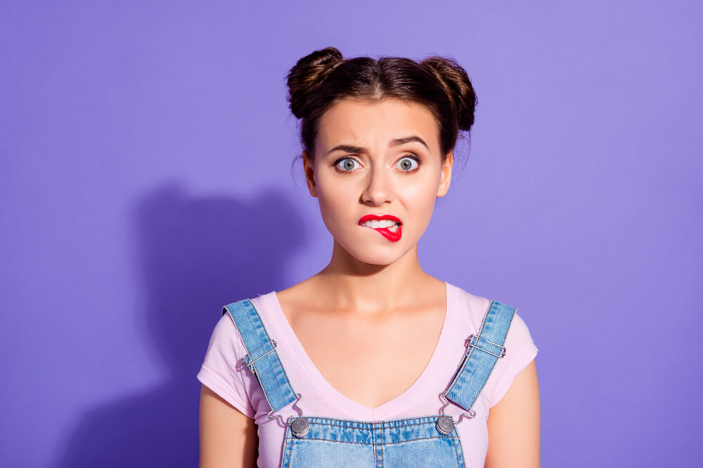 woman standing in front of purple background